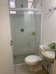 Um banheiro em Vila Stellino Suítes