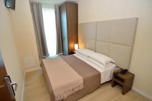 Postel nebo postele na pokoji v ubytování Hotel San Giuliano