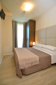 מיטה או מיטות בחדר ב-Hotel San Giuliano