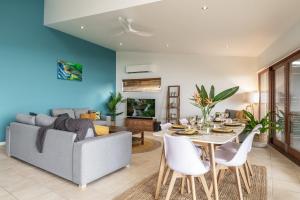 a living room with a couch and a table at Oceanic Blue - East Ballina in East Ballina