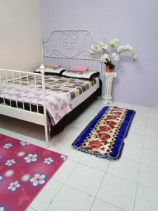 Ένα ή περισσότερα κρεβάτια σε δωμάτιο στο Temerloh Guesthouse for Muslim