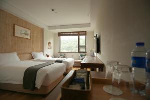 Una cama o camas en una habitación de 武当山太和紫隐酒店