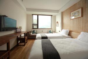 Una cama o camas en una habitación de 武当山太和紫隐酒店
