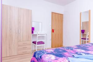 En eller flere senge i et værelse på Apartment Snjezana