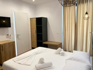 Кровать или кровати в номере Hotel Platon