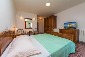 Postel nebo postele na pokoji v ubytování Adria Brela Apartments