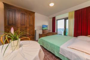 Postel nebo postele na pokoji v ubytování Adria Brela Apartments