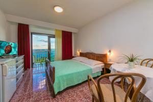 Postel nebo postele na pokoji v ubytování Adria Brela Apartments