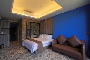 Rúm í herbergi á 花蓮諾丁漢海景民宿 Nottingham Seaview Inn