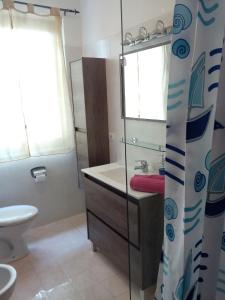 a bathroom with a sink and a toilet at Appartamento Flora in Tremosine Sul Garda