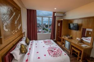 A bed or beds in a room at UCT Taunggyi Hotel