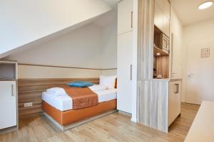 Кровать или кровати в номере VR-Serviced Apartments Obergeis