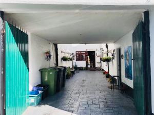 a hallway of a building with trash cans at Little Mermaid Cottage in Dawlish