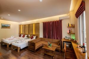 A bed or beds in a room at UCT Taunggyi Hotel