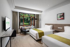 Krevet ili kreveti u jedinici u objektu Holiday Inn Hangzhou Chaoshan, an IHG Hotel