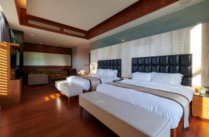 Giường trong phòng chung tại Reikei Hot Spring Resort