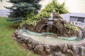 a fountain in the middle of a yard at RI-VAL in Valandovo