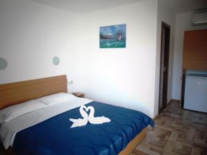 Postel nebo postele na pokoji v ubytování Casa Albatros