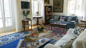 a living room with a couch and a table at Mansion Alexandri in Hydra