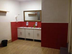 a bathroom with a sink and a mirror at Break N Bed in Barcelona