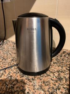 a silver coffee pot sitting on a counter at The Penthouse in Alora