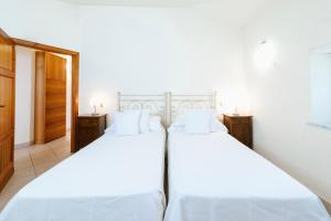 Llit o llits en una habitació de Casa GINESTRA a Bagno Vignoni