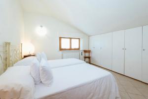 Llit o llits en una habitació de Casa GINESTRA a Bagno Vignoni