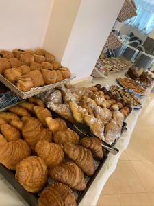 a bunch of pastries on display in a bakery at Hotel Bahia in San Benedetto del Tronto