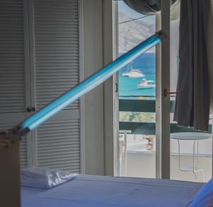 A bed or beds in a room at Keros Art Hotel