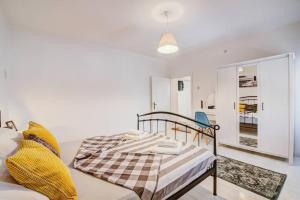 a bedroom with a bed and a living room at Vacation home Korina in Senj