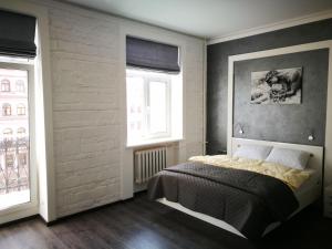 Säng eller sängar i ett rum på Яркая история