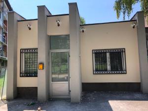 a building with a door and windows on it at Apartment Tesla in Pančevo