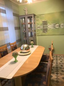 a dining room table with a silver bowl on it at Ferienwohnung Ils in Wittmund in Wittmund