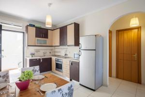 Η κουζίνα ή μικρή κουζίνα στο Andrew apartment