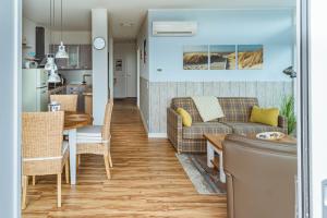 a living room with a couch and a table at Waterbed Barth in Barth