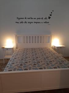 Łóżko lub łóżka w pokoju w obiekcie Casa Vacanze Mannina