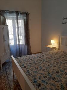 Łóżko lub łóżka w pokoju w obiekcie Casa Vacanze Mannina
