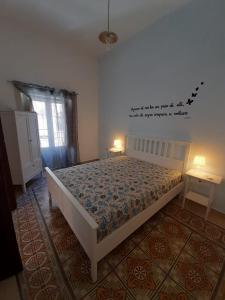 Łóżko lub łóżka w pokoju w obiekcie Casa Vacanze Mannina