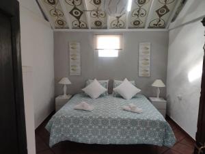 Un pat sau paturi într-o cameră la Finca Lomo Grande