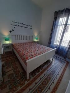 Łóżko lub łóżka w pokoju w obiekcie Casa Vacanze Mannina