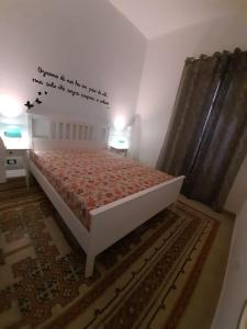 Łóżko lub łóżka w pokoju w obiekcie Casa Vacanze Mannina