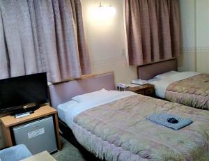 Postel nebo postele na pokoji v ubytování Matsue Plaza Hotel + 36 fotografií