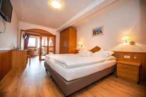 Postel nebo postele na pokoji v ubytování Astor Suites B&B