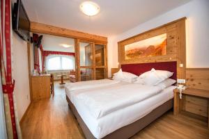 Postel nebo postele na pokoji v ubytování Astor Suites B&B