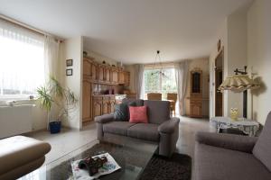 a living room with a couch and a table at Feriendomizil Hönow in Hoppegarten