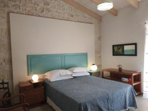 Postel nebo postele na pokoji v ubytování Casa Spanos
