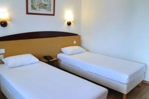 Letto o letti in una camera di Travelodge Barcelona del Vallés