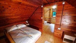 an overhead view of a bedroom in a log cabin at Forrest House in Golnik