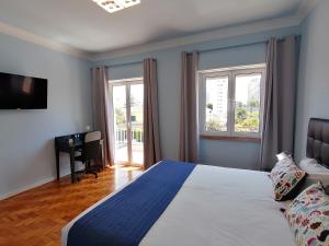Posteľ alebo postele v izbe v ubytovaní SK Lisboa Villa Guesthouse