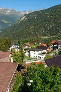 a view of a town with mountains in the background at Haus Helvetia in Ladis